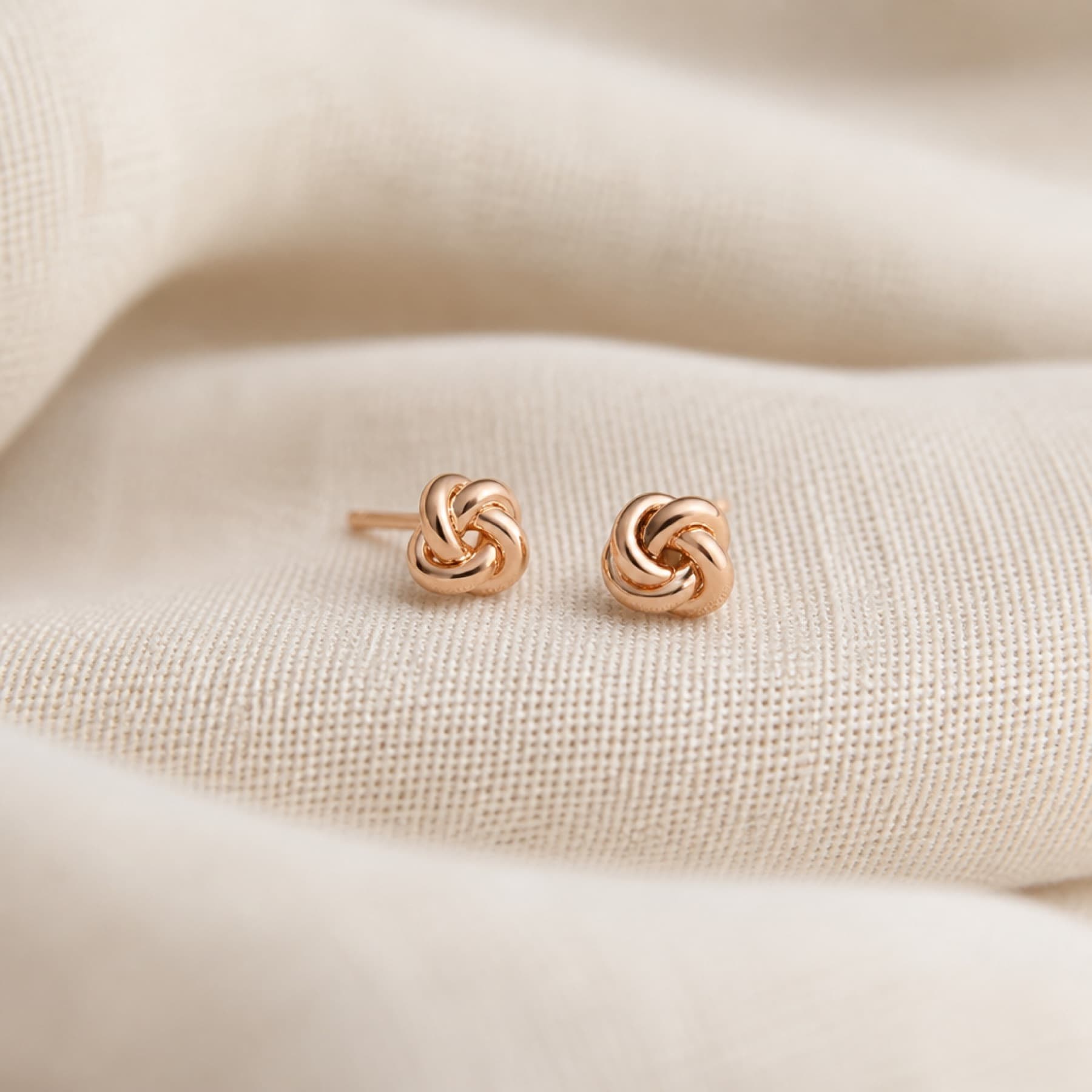 Knot Stud rose-tone earrings